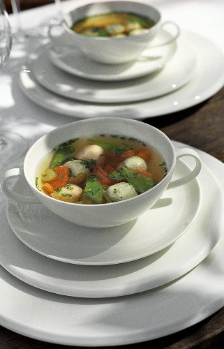 Chicken broth with vegetables, chicken- and prawn dumplings