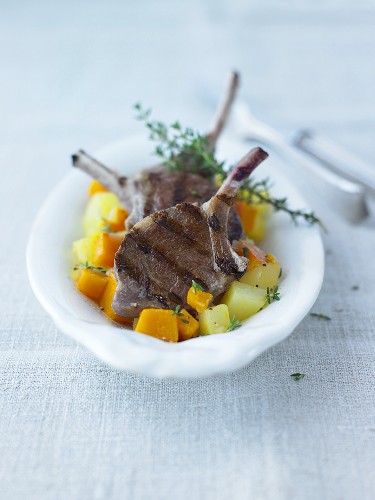 Grilled lamb chops on pumpkin and potatoes