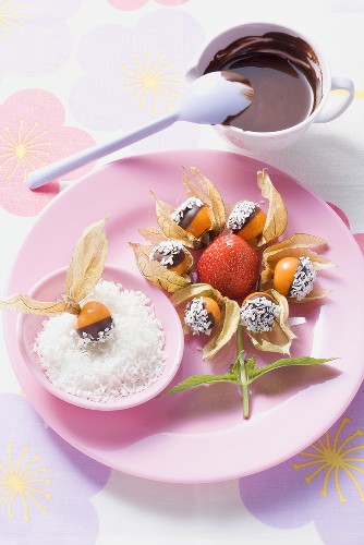 Chocolate-dipped fruit with grated coconut