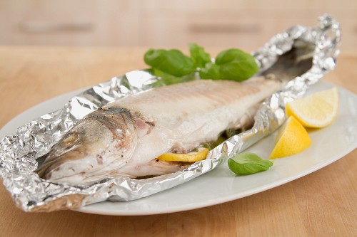 Sea bass cooked in aluminum foil