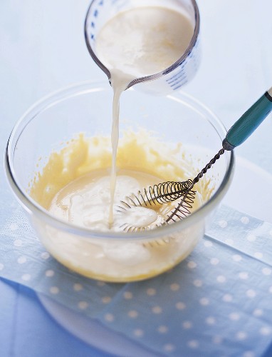 Making vanilla ice cream: adding the milk