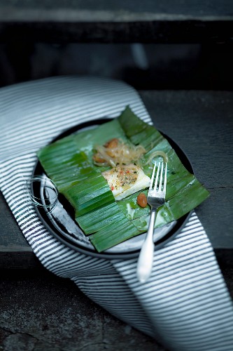 Halibut wrapped in banana leaves