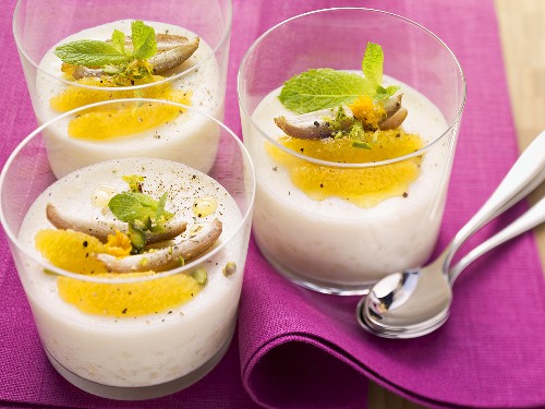 Rice pudding with orange slices and pistachios