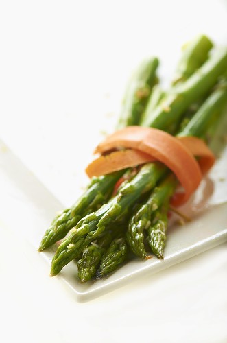 Slice of Carrot Wrapped Around Asparagus Spears