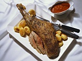 Leg of Lamb with Potatoes and Tomato Sauce