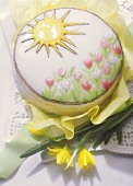 Decorated spring cake with iced tulips & sun