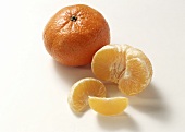 Whole and peeled clementine