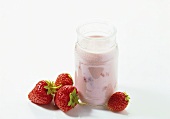A glass of strawberry yoghurt