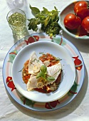 Cod fillet with mushrooms and tomatoes