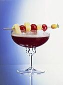 Red Kiss Champagne Cocktail with Skewered Fruit