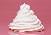 Whipped Cream Dollop on Pink Background