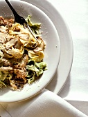 Yellow and green ribbon pasta with mushrooms (Italy)