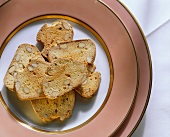 Cantucci (almond biscuits on pink plate), Tuscany, Italy