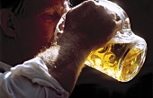 Man Drinking a Liter of Beer