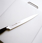Meat knife and chopping board