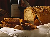 Slicing a Loaf of Homemade Whole Grain Bread