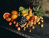 Fruit and nut still life on stone table
