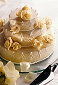 White wedding cake with marzipan roses