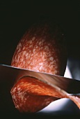Close Up of Salami Being Sliced