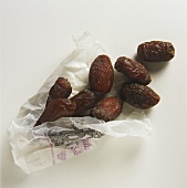Dried dates in a paper bag