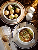 Bouillon with choux pastry garnish and onion soup
