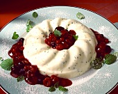 Yogurt mint pudding with raspberry sauce