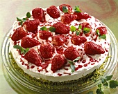 Strawberry gateau with pistachio  pastry base & cream topping