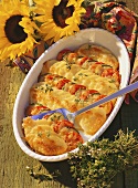 Potato gratin with tomatoes and courgettes