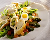 Asparagus in puff pastry on lettuce