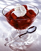 Strawberries in red wine with a blob of cream