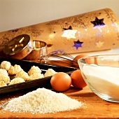 Baking scene - coconut macaroons on baking sheet, ingredients