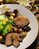 Sliced duck breast with cranberry and melon sauce & salad