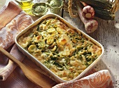 Vegetable bake with green ribbon noodles in casserole dish