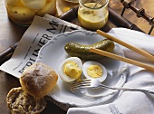 Pickled boiled eggs with mustard and gherkin