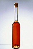 Peach liqueur in unlabelled bottle