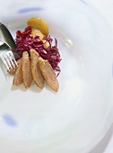 Red cabbage salad with sliced roast duck breast