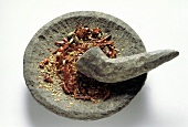 Crushed Chili Peppers in a Mortar with Pestle