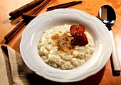 Rice pudding with cinnamon topped with strawberry pieces