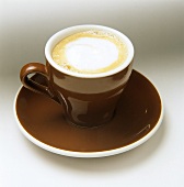 A brown cup of cappuccino