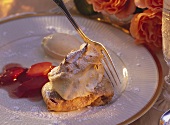 Folded rhubarb crepe topped with meringue