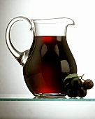 Grape Juice in a Glass Decanter; Grapes