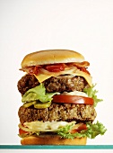 Double-decker Burger with Cheese, Mayonnaise, Tomato, Lettuce, Onion, Pickles, Bacon and Ketchup