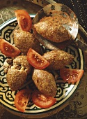 Fried Bulgur Dumplings with Meat Filling; Tomatoes