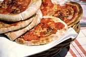 Pizza with Tomatoes and Herbs in Basket