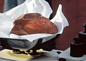 A Rib Eye Roast On Butcher's Paper in a Dutch Oven
