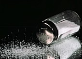 A Salt Shaker Tipped Over with Salt