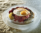 Labskaus (fish & potato dish), fried egg, beetroot & gherkins
