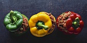 Three raw peppers stuffed with mince