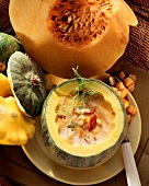 Pumpkin & barley soup with paprika in hollowed-out pumpkin