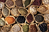 Assorted peas, lentils and beans in paper bags